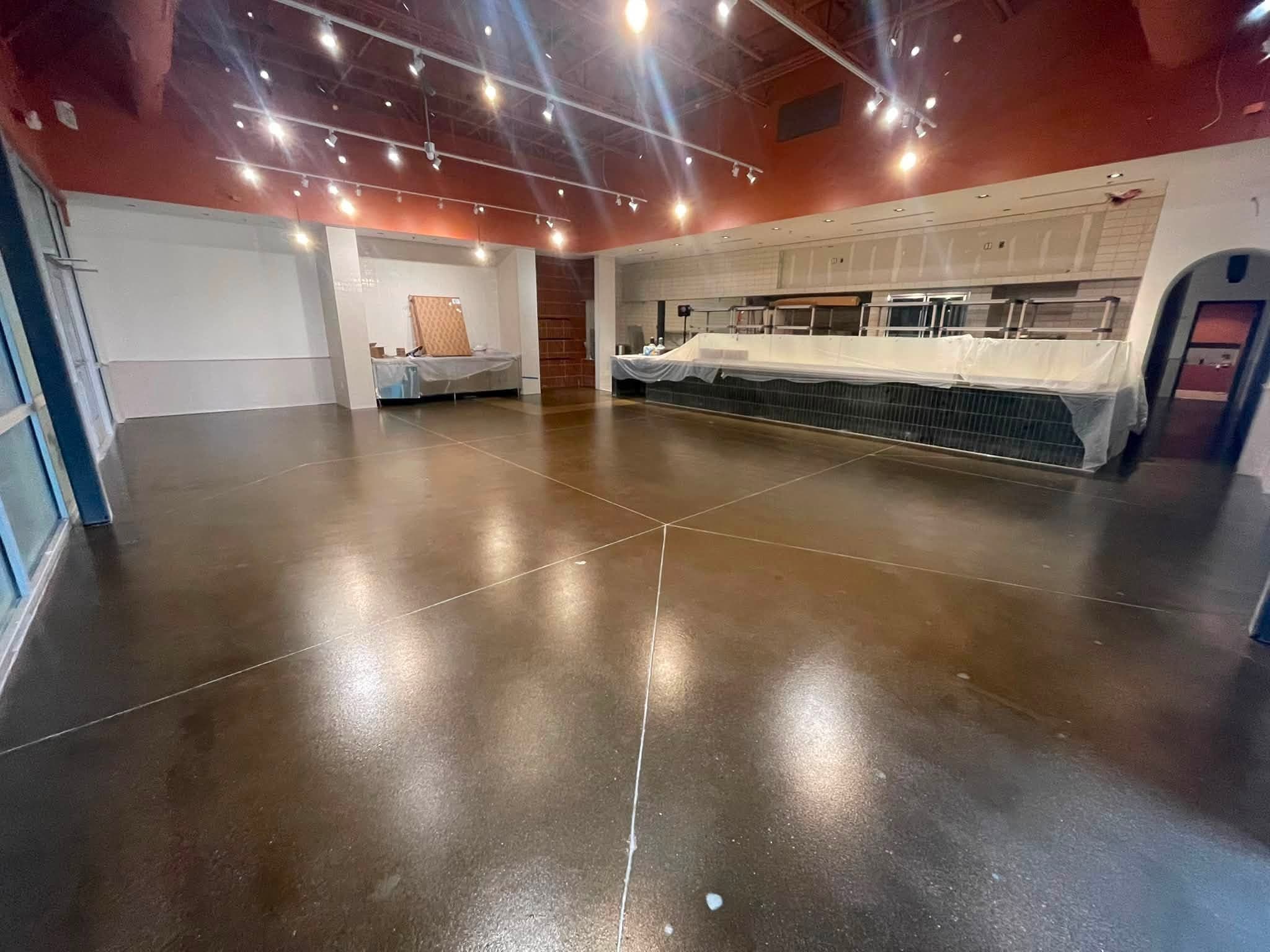 Sealed concrete running to a restaurant service counter