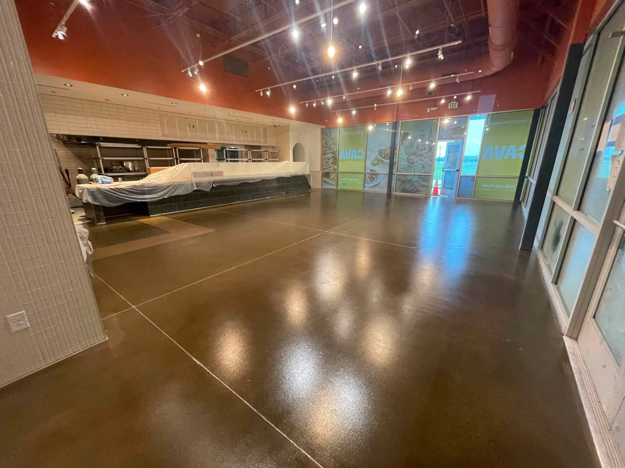 Sealed concrete running to the service counter in a finished restaurant