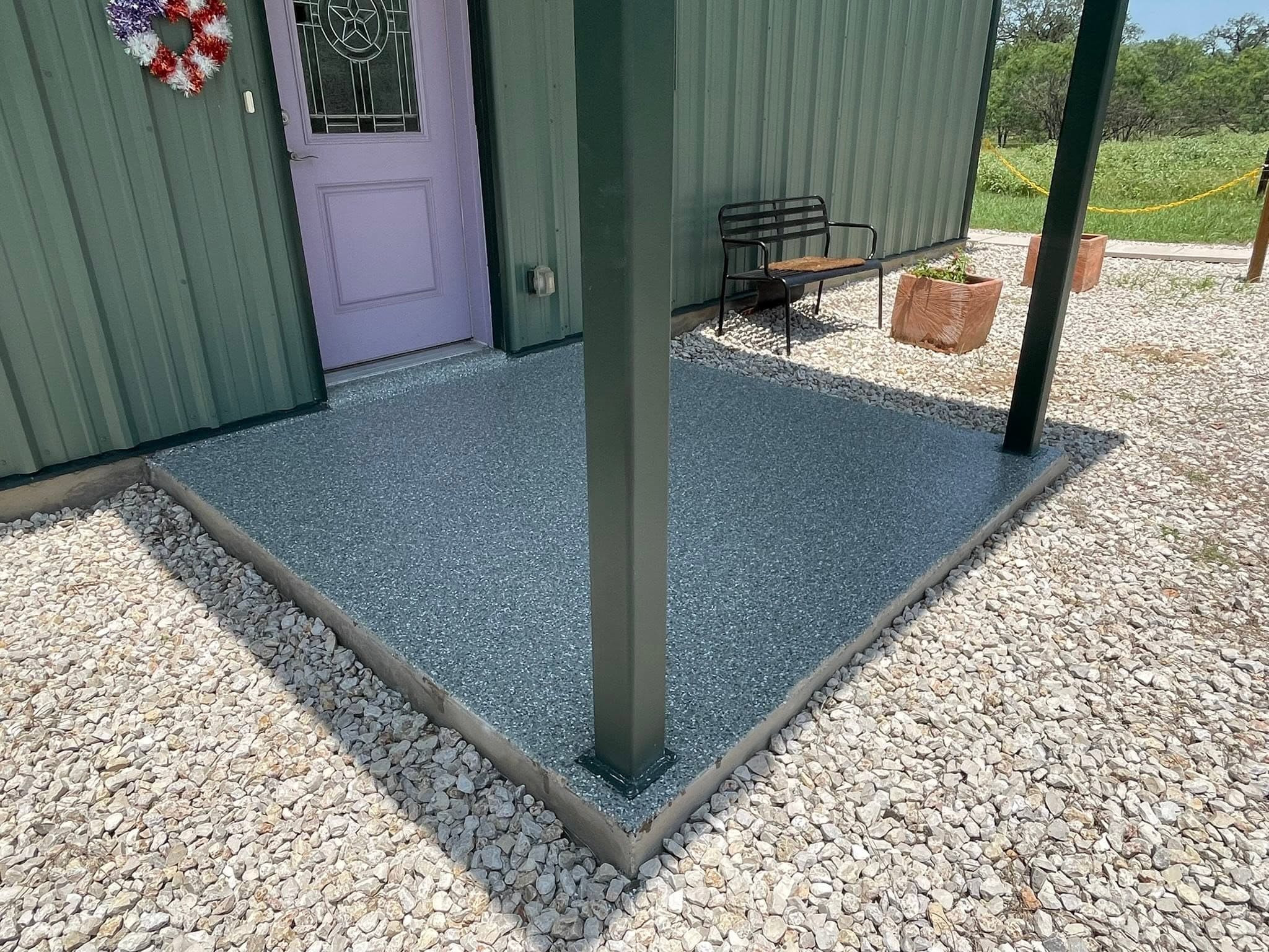 The finished front porch corner with live oaks behind