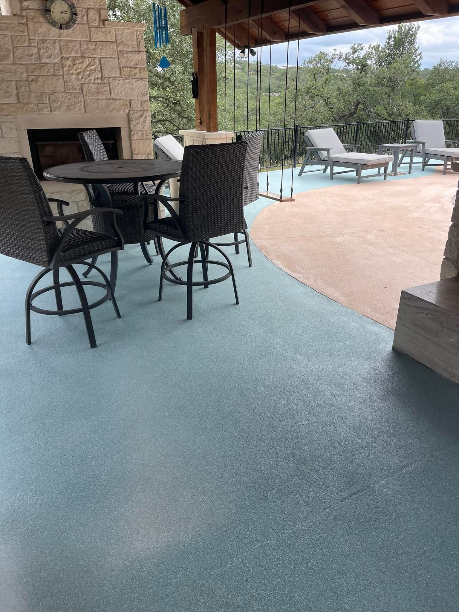 Teal and tan two-tone custom-tinted deck coating on a covered patio